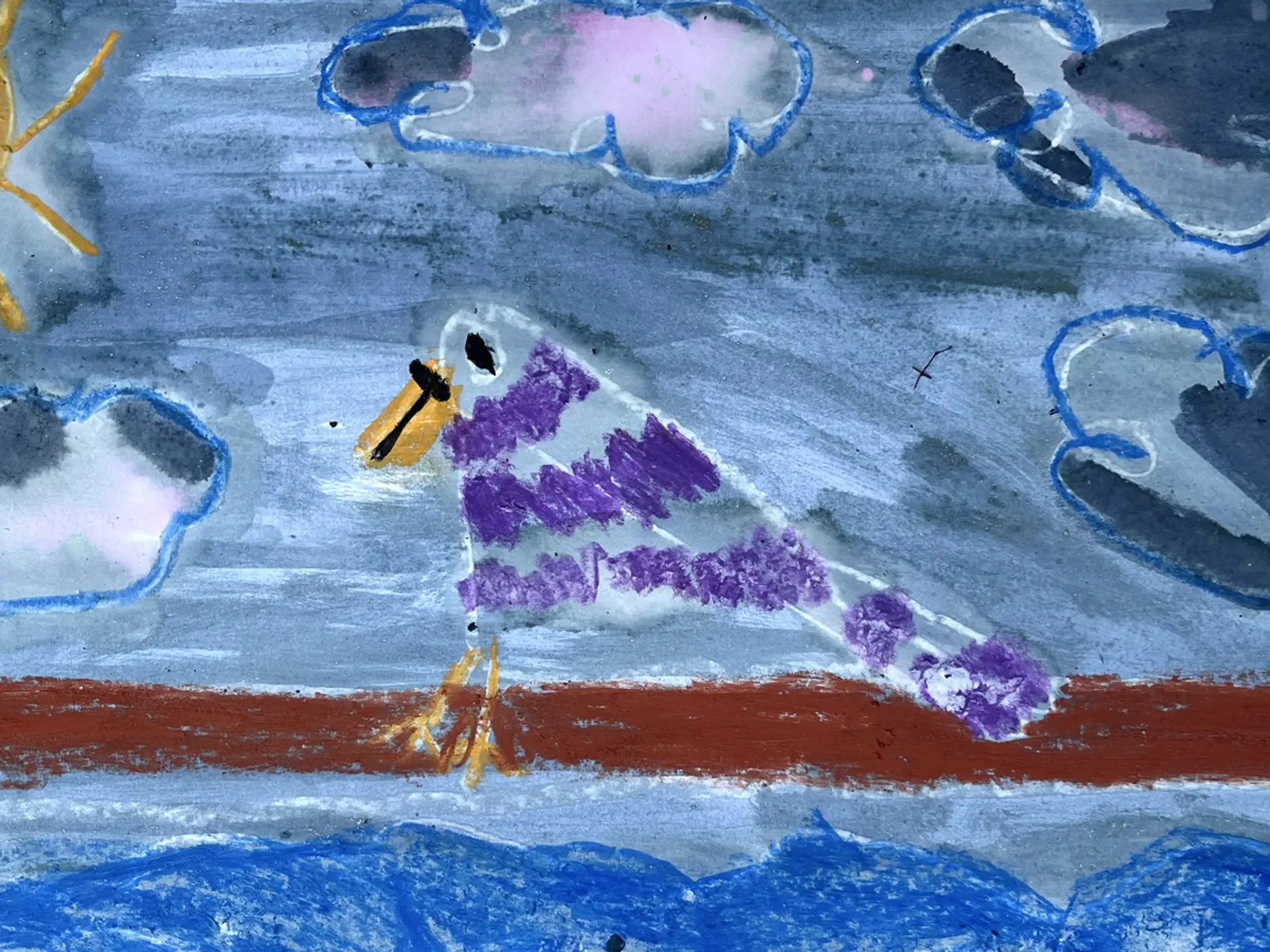 An image of a small striped purple bird on a brown branch painted with blue elderberry ink and oil pastels.The bird has a yellow beak and feet. There are blue clouds in the sky and in the corner of the image we can see a yellow sun.