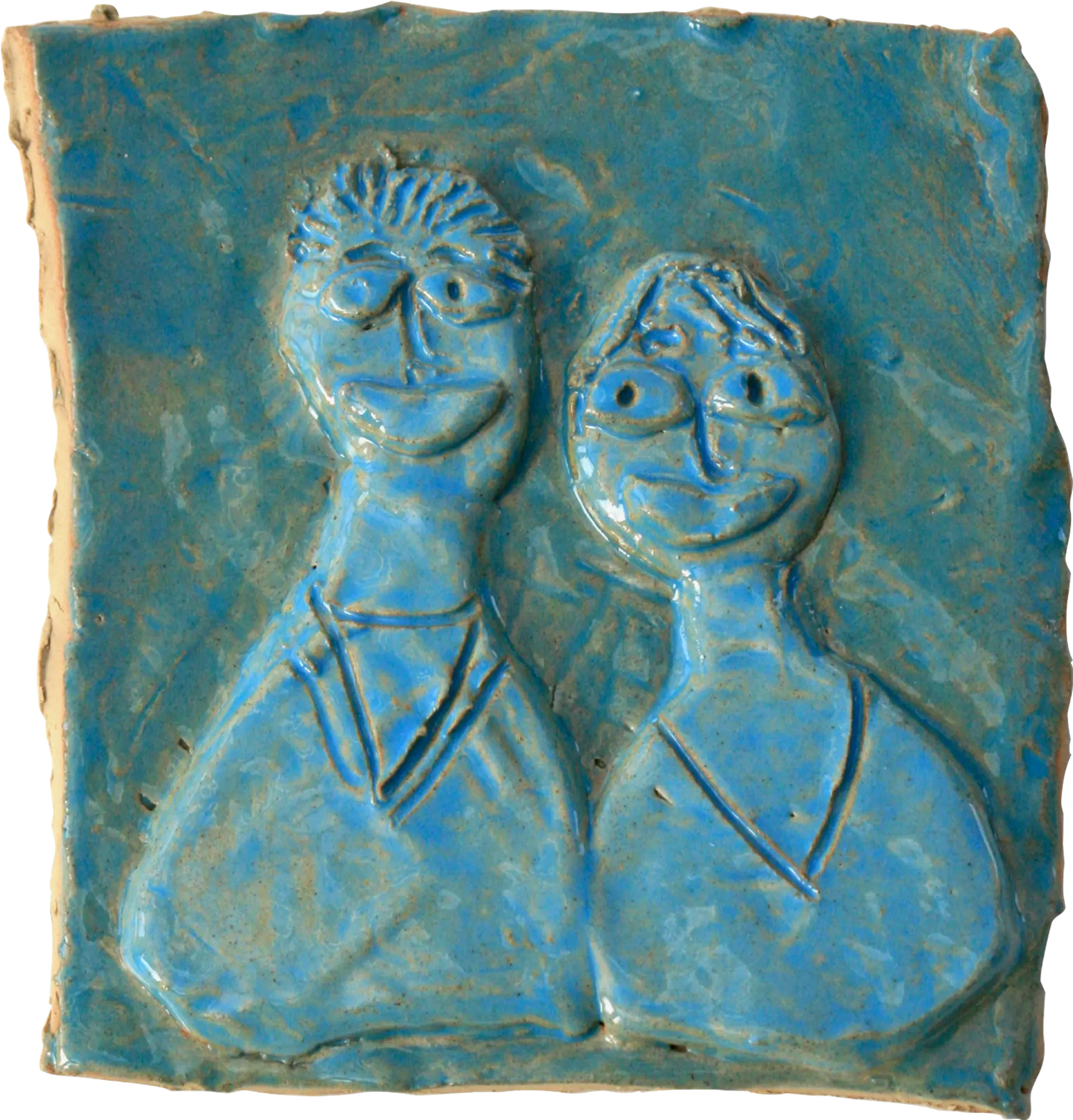 A blue glazed ceramic tile of Ena’s sister and brother-in-law. They are wearing v-neck tops and are smiling, their heads are close together. 