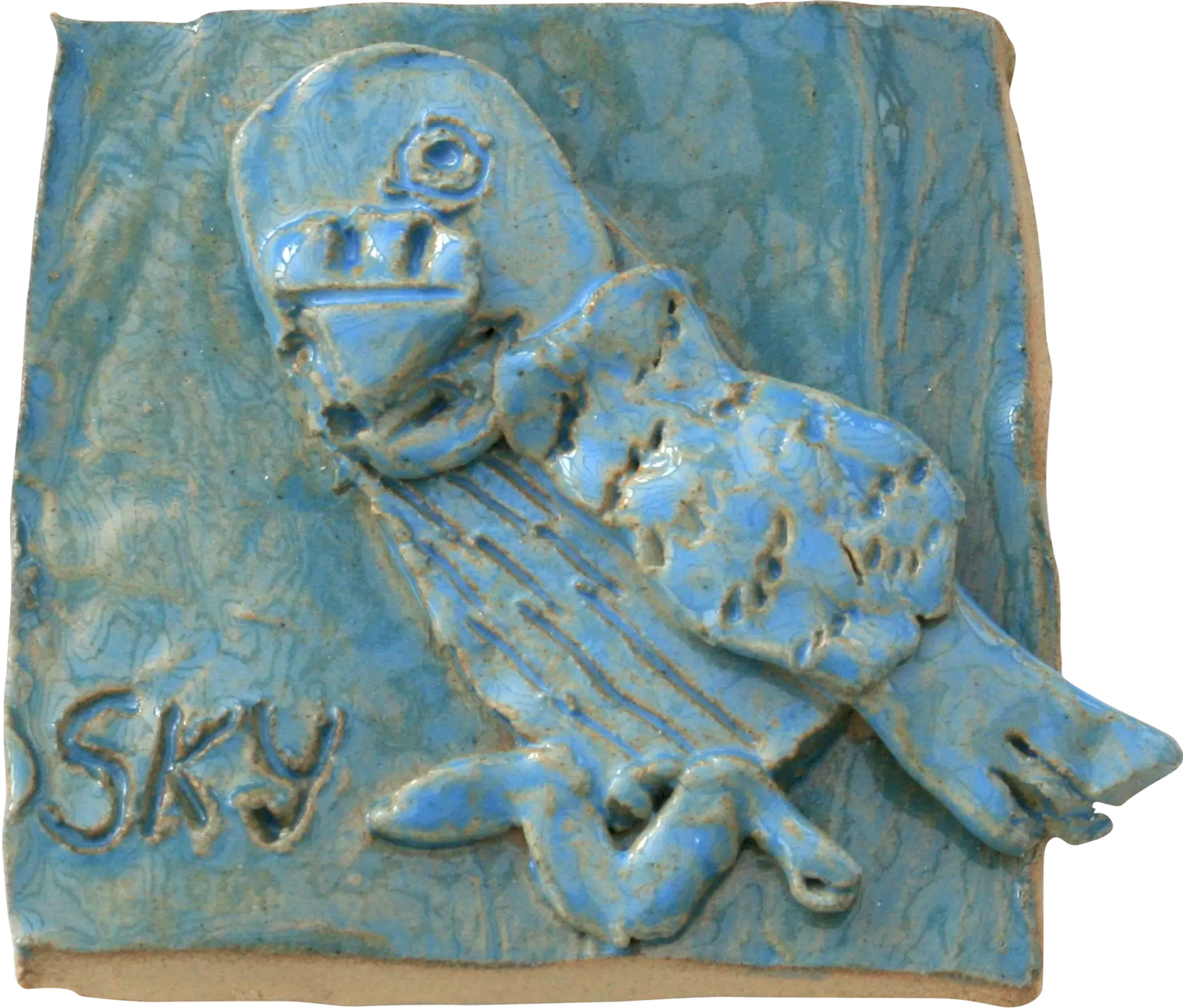 A blue glazed ceramic tile of Jessica’s pet budgie, Sky.