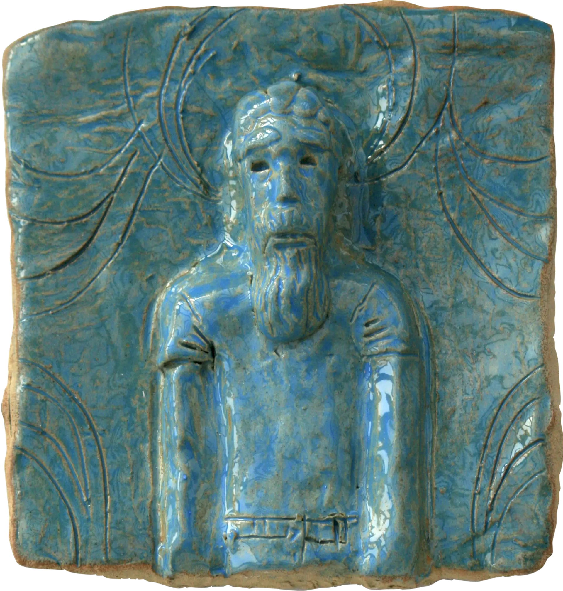 A blue glazed ceramic tile of Alexander’s brother Richard. The background has been decorated with curved lines. 