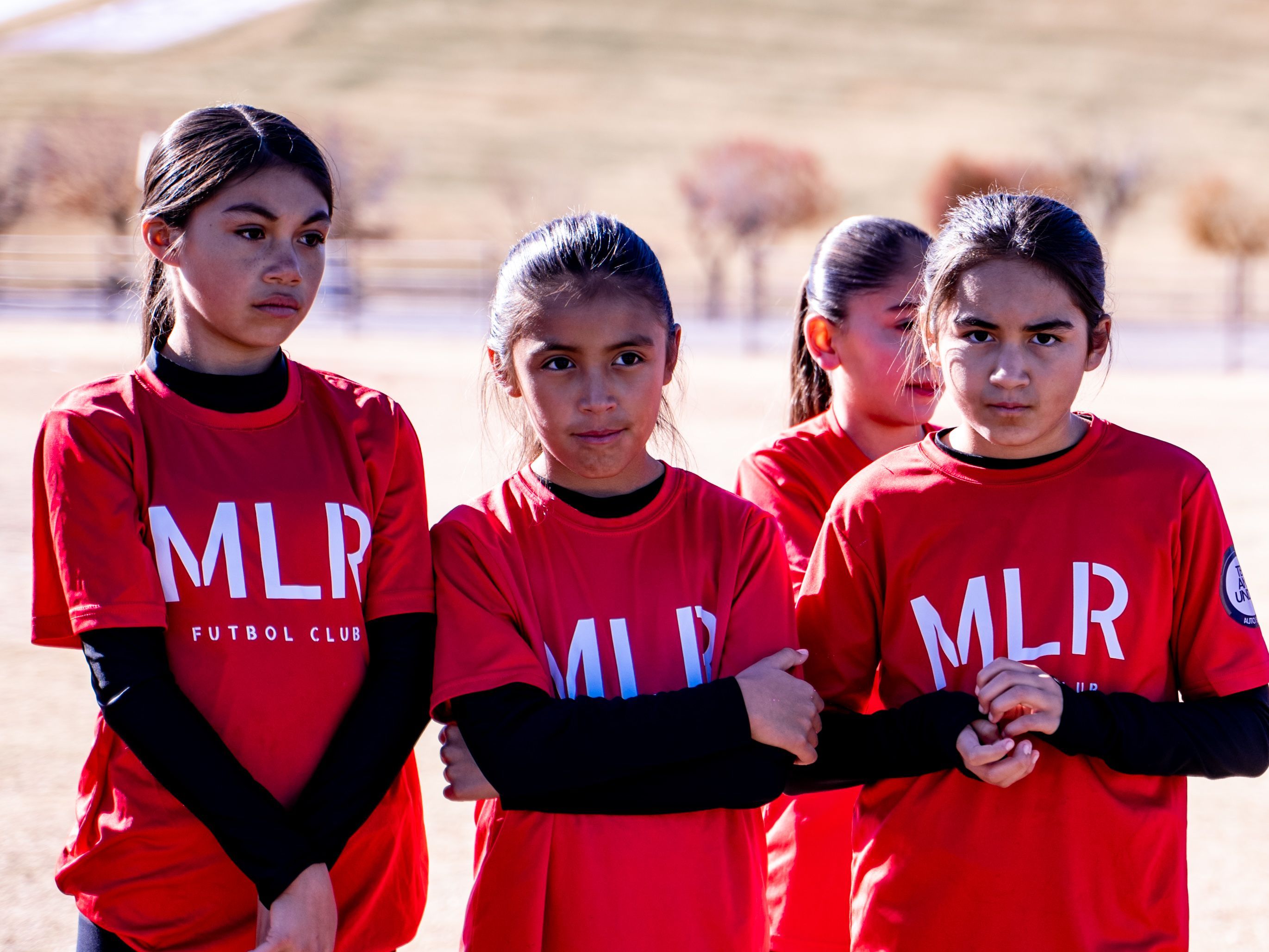Three Girls U14 players on the sideline