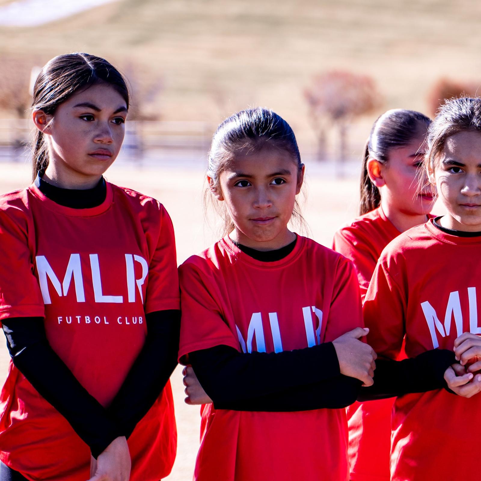 Three Girls U14 players on the sideline
