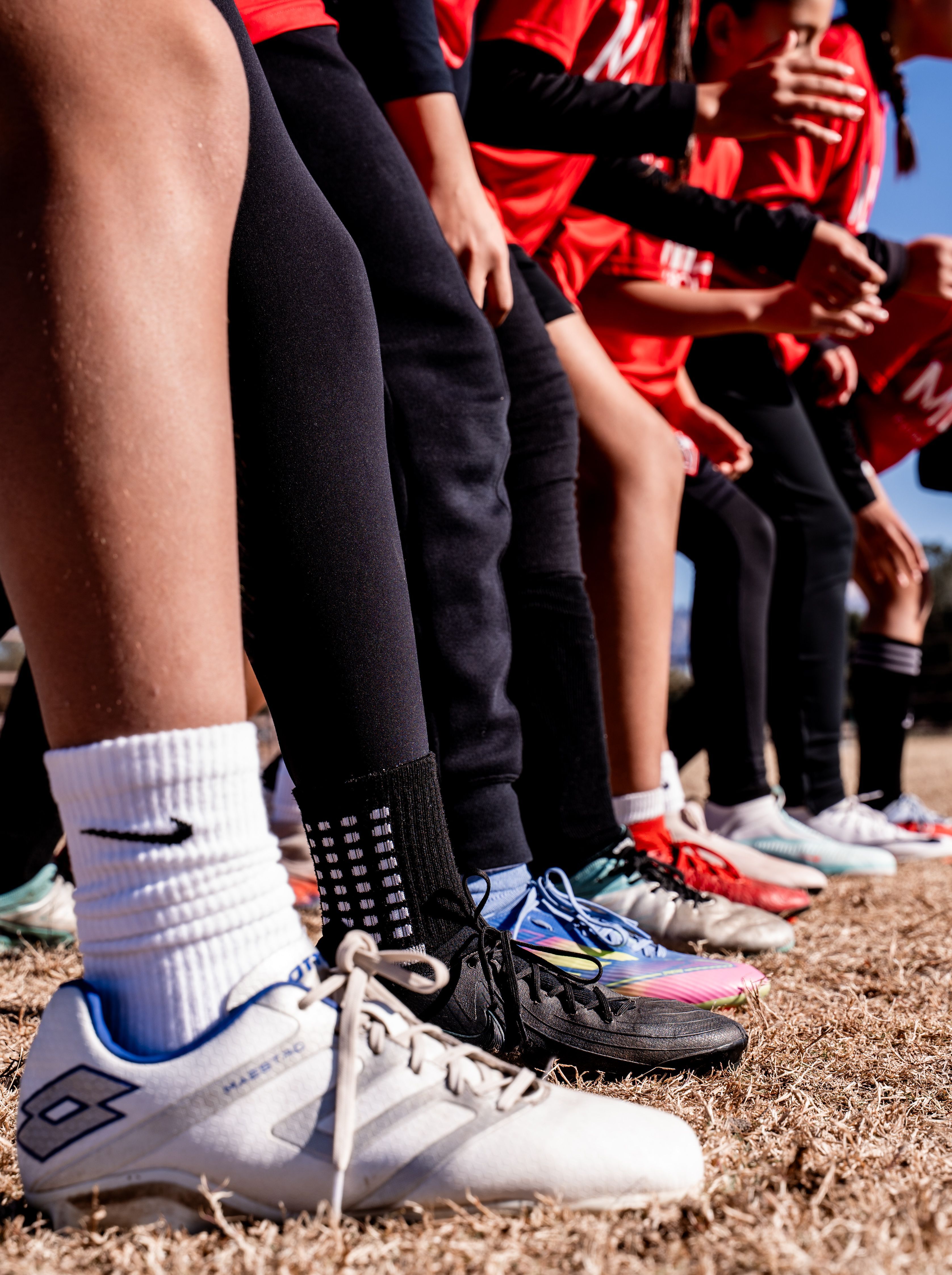 Socks and cleats on the sideline