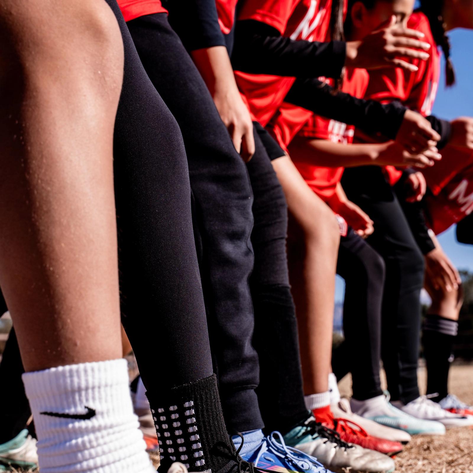 Socks and cleats on the sideline