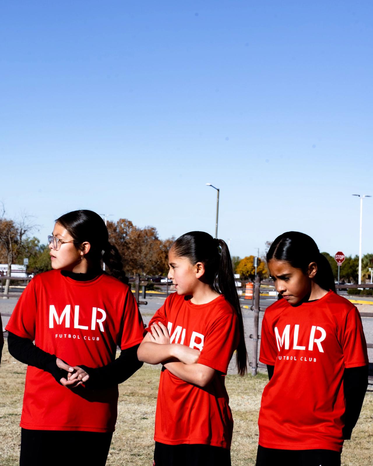 Three Girls U14 players in MLR FC shirts