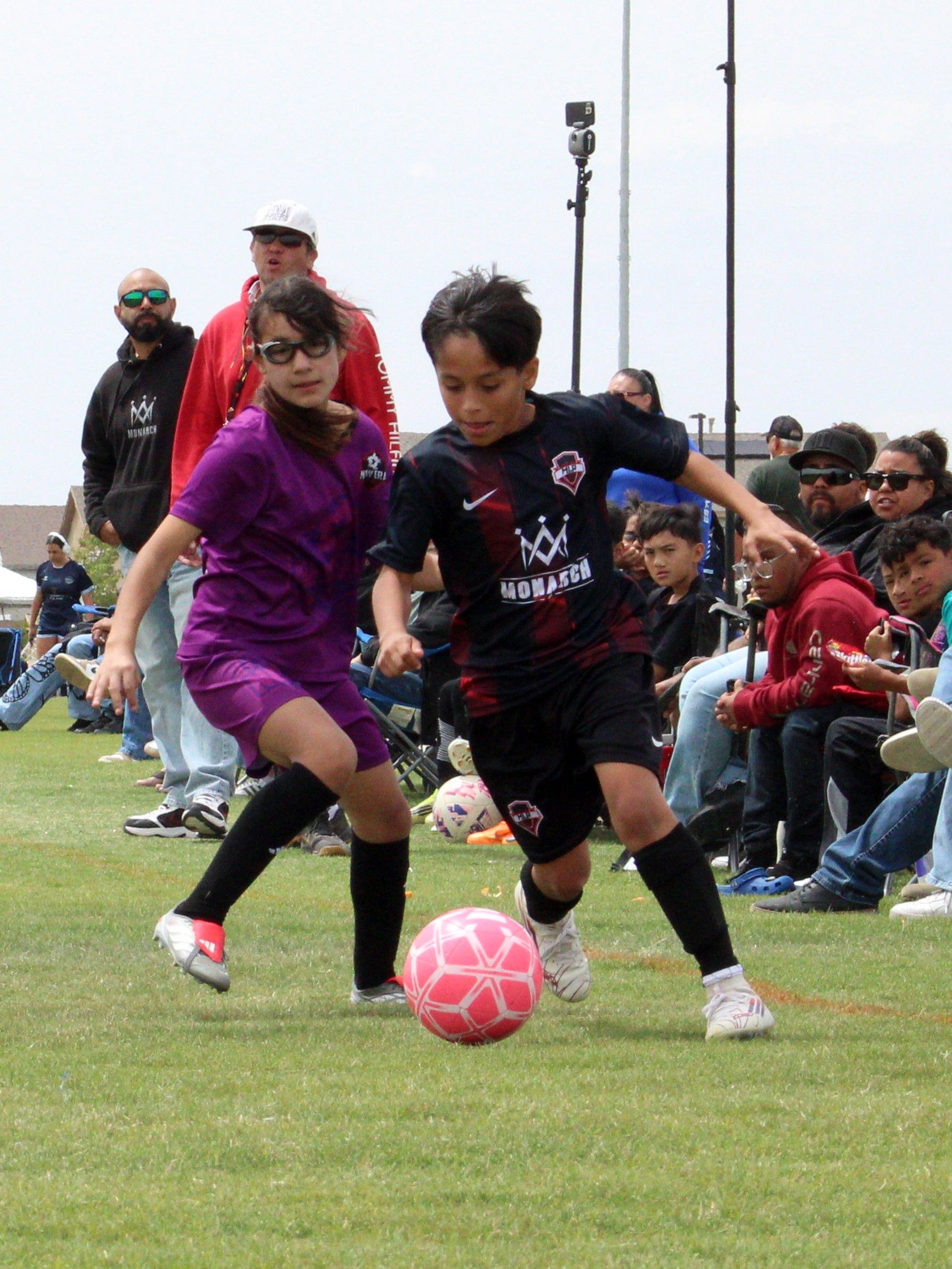 Boys player dribbling past a defender