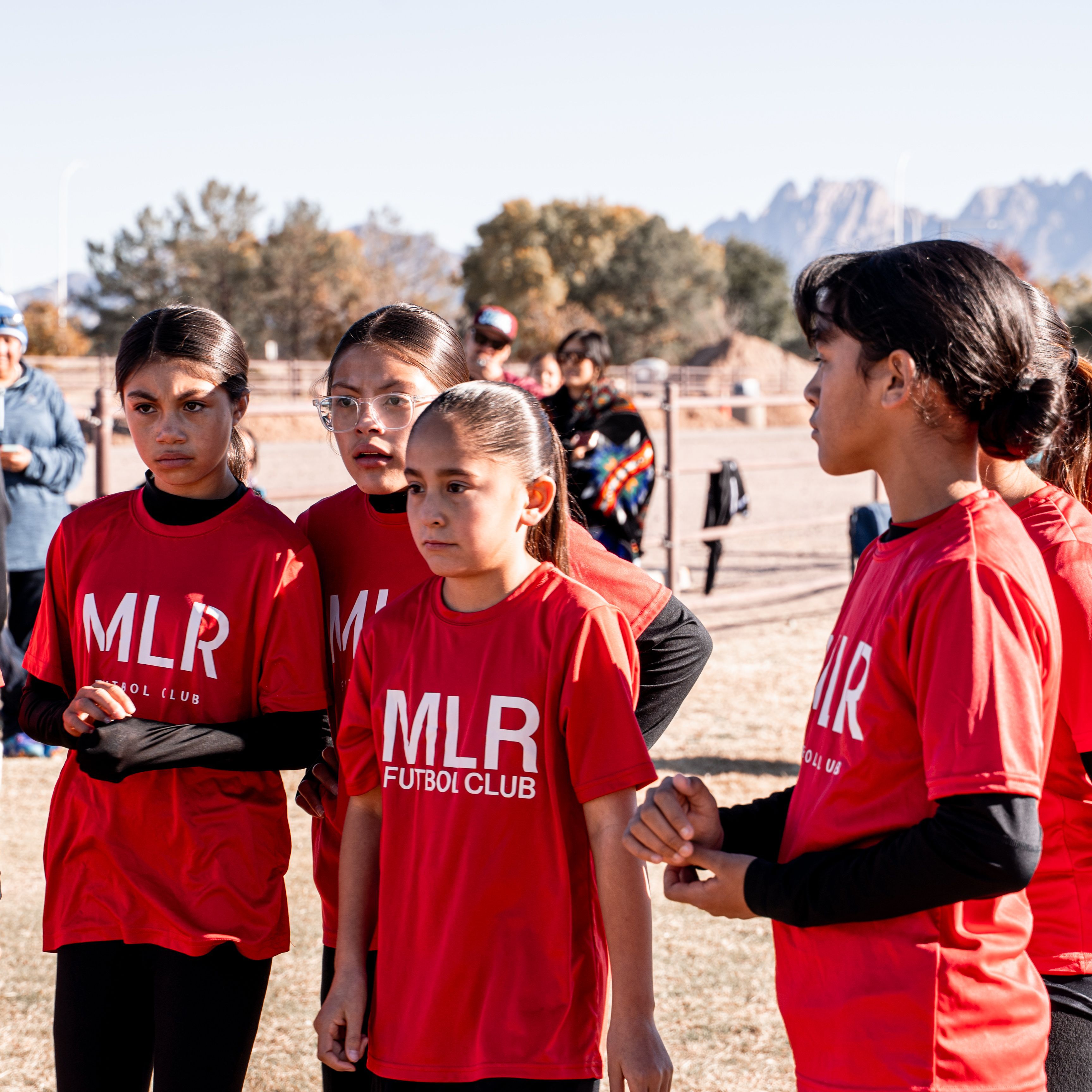 Girls U14 gathered before practice, Organ Mountains in the background