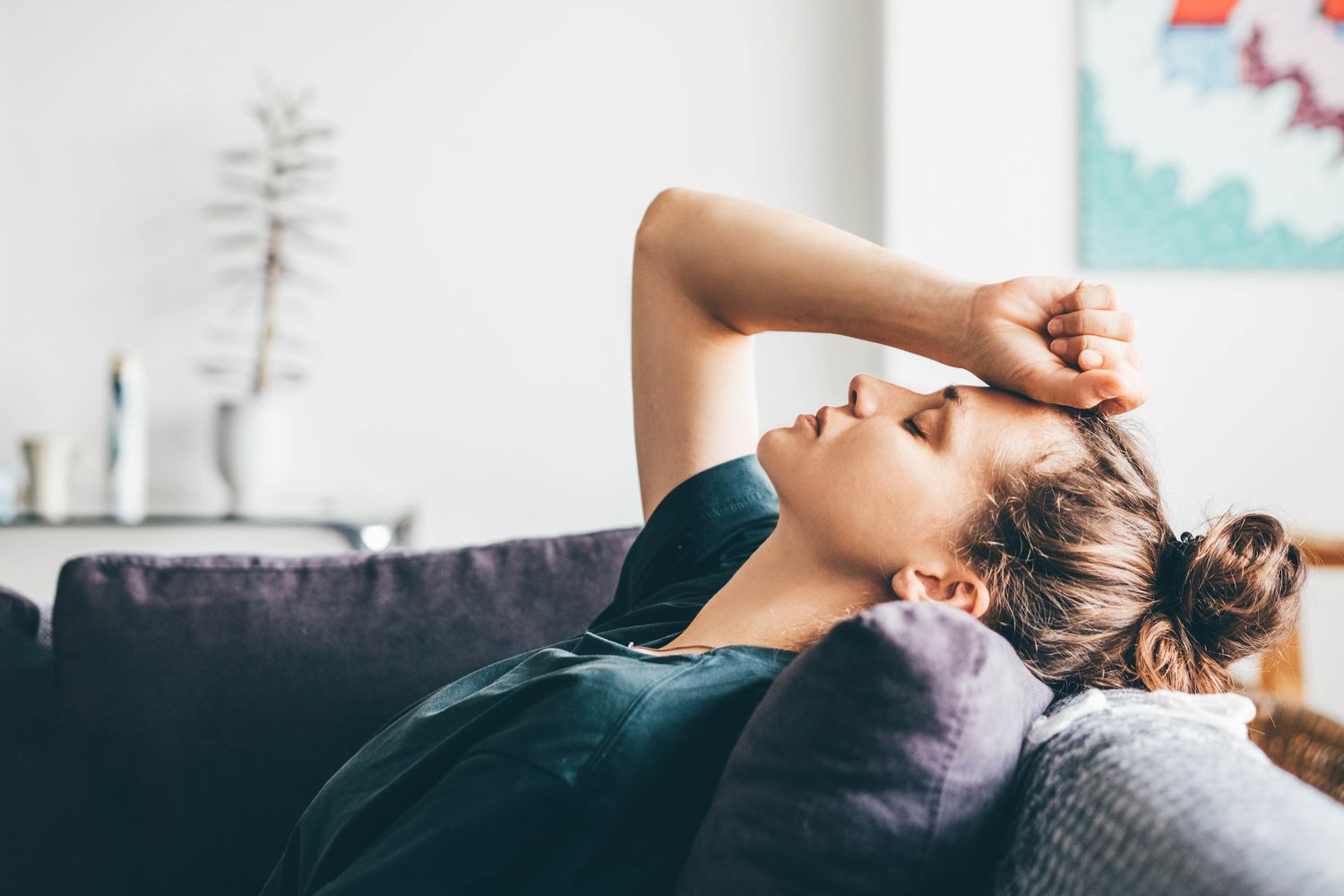 A person sitting quietly in a calm space, representing the journey of coping with anxiety and finding inner peace