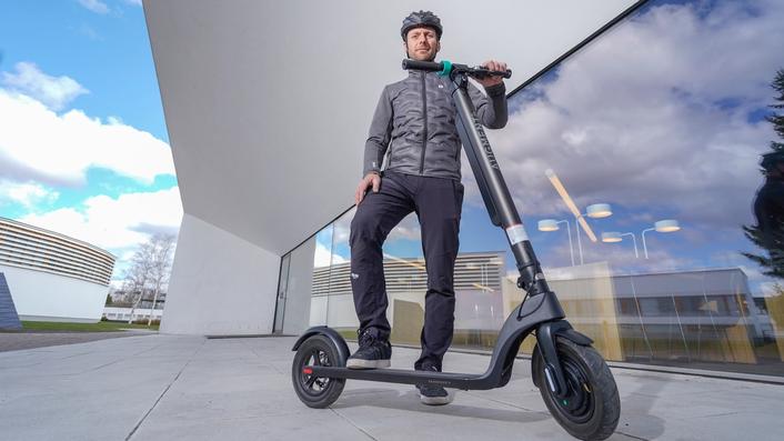 Man riding an e-scooter