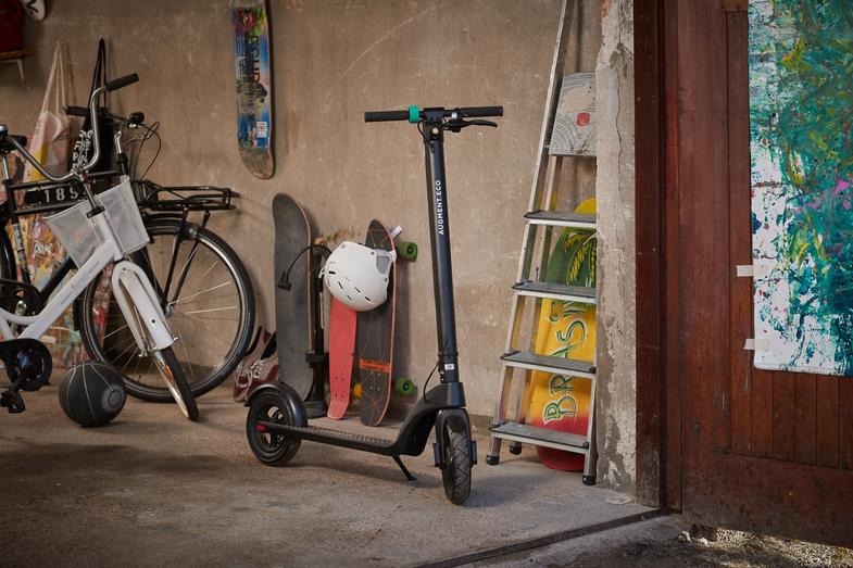An Augment e-scooter in a garage