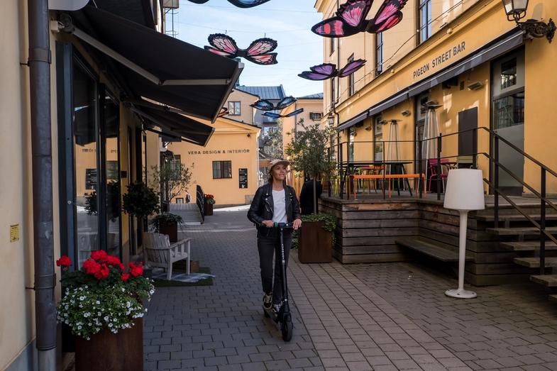 Woman riding a ES 210 scooter