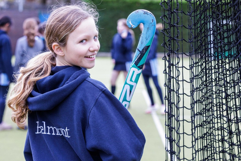 Belmont, Mill Hill Prep School pupil with hockey stick