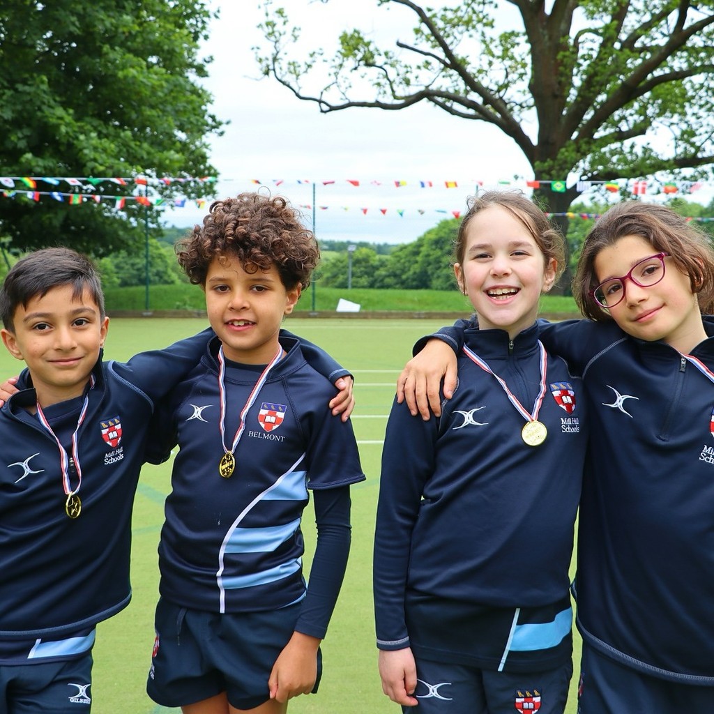 Young pupils wearing medals 