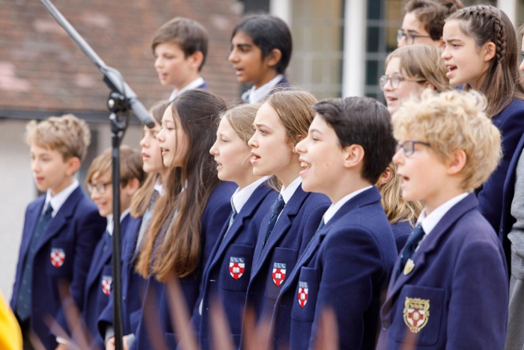 Pupils performing outdoors 