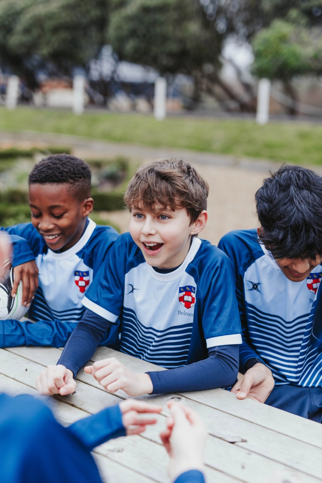 Belmont, Mill Hill Prep pupils enjoying outdoor activities on a wooden climbing structure.