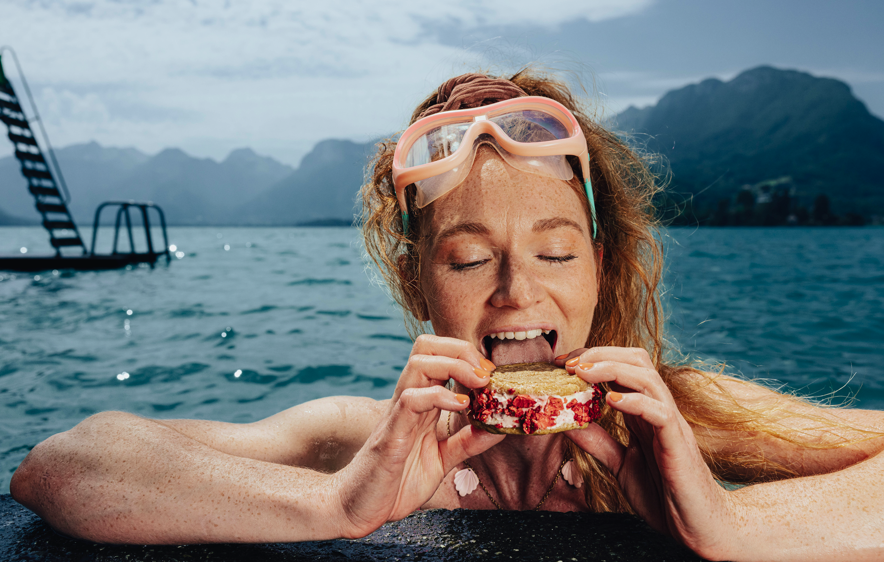Woman eating ice cream in the ocean