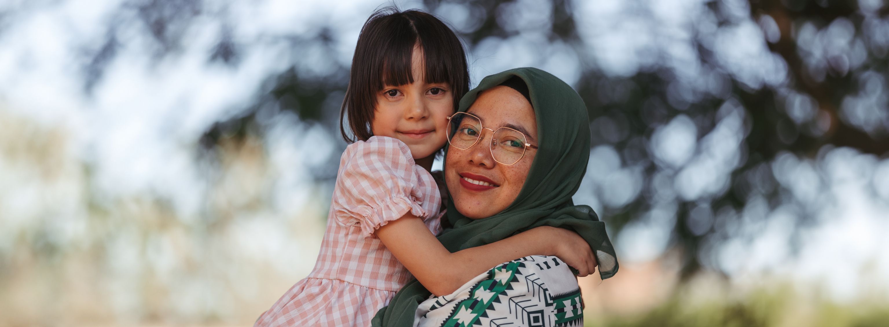 Women and child smiling at the camera