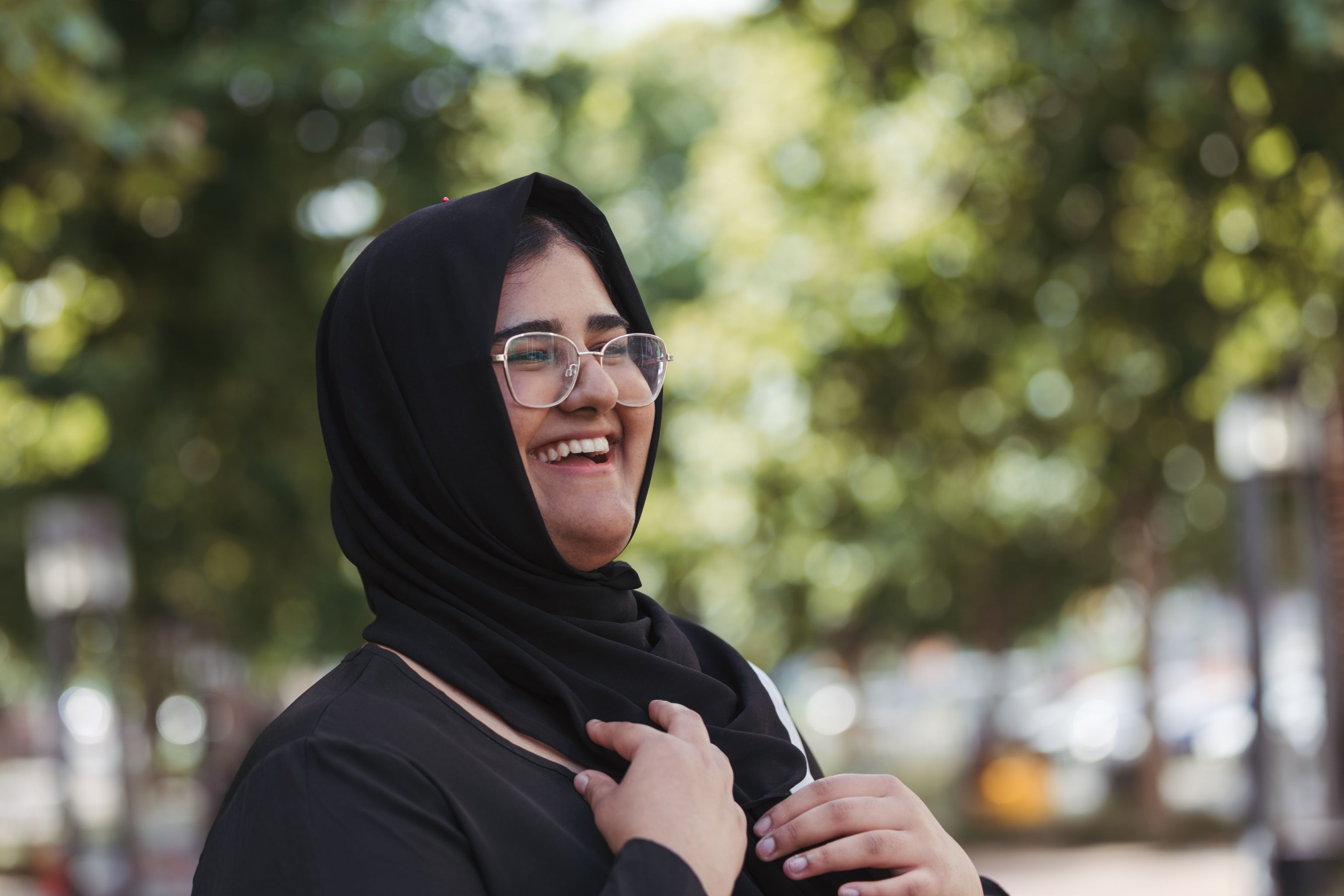 Young female Each staff member wearing a hijab and smiling and looking forward