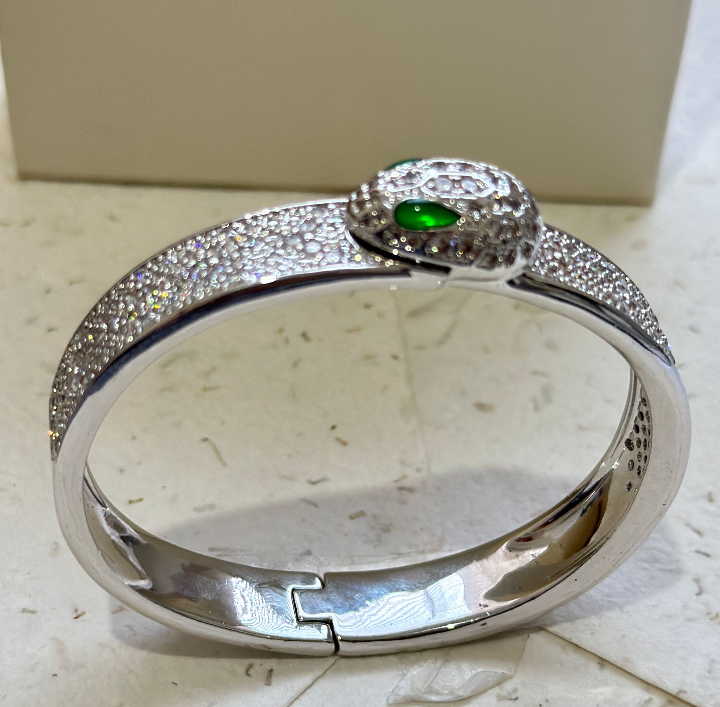 Esclava de acero serpiente con circones y esmeralda - Código K344