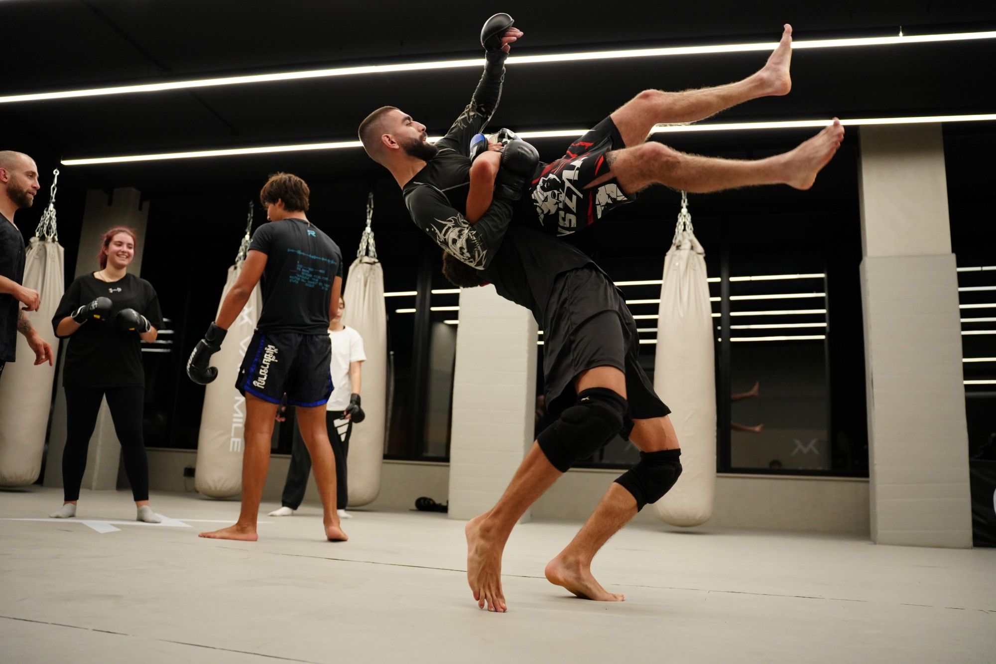 MMA takedown on the Mat Arena