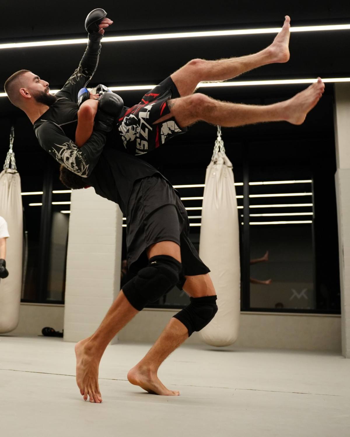 MMA takedown on the Mat Arena