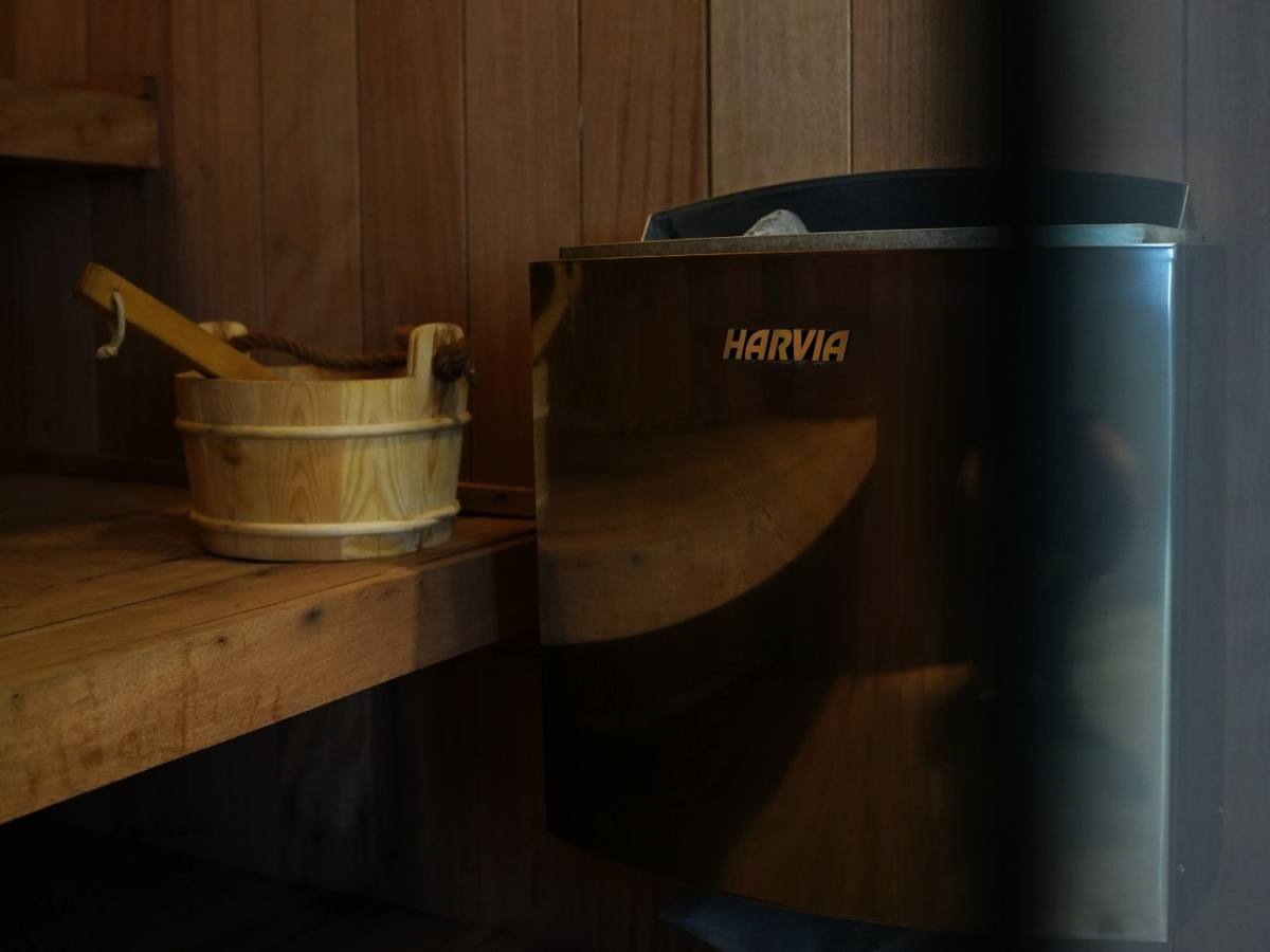 Harvia sauna heater and wooden bucket