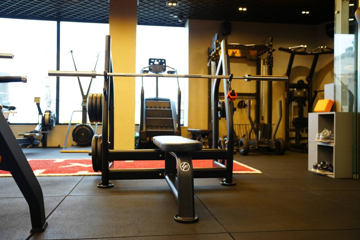 Life Fitness bench and barbell on the gym floor