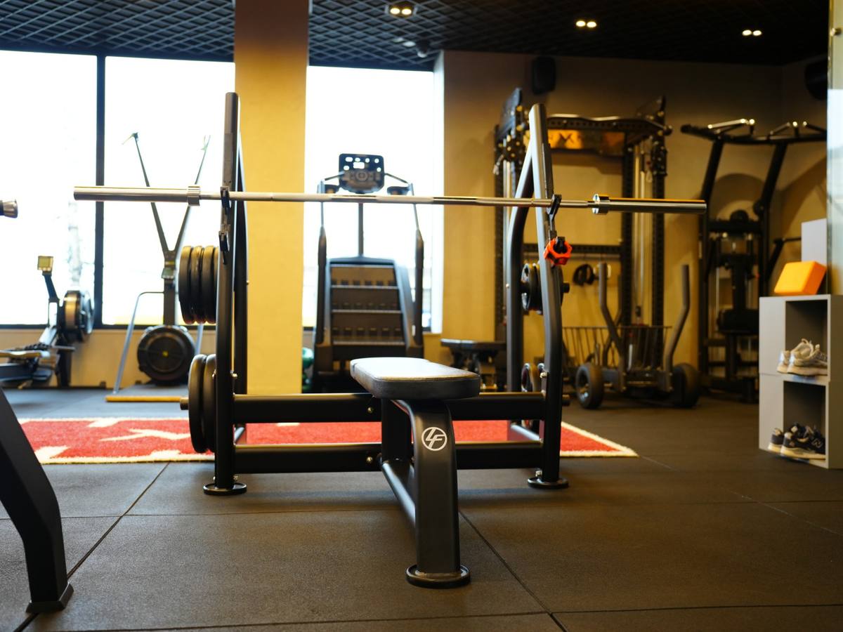 Life Fitness bench and barbell on the gym floor