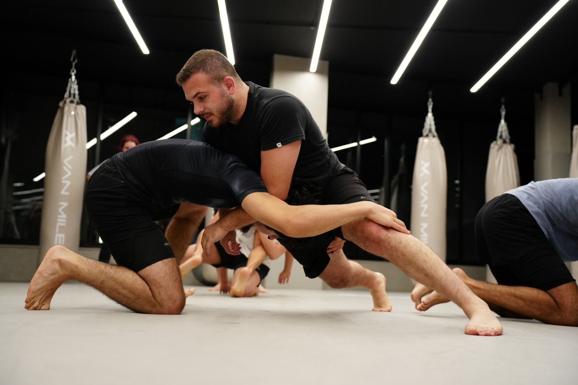 Takedown drill during a grappling class