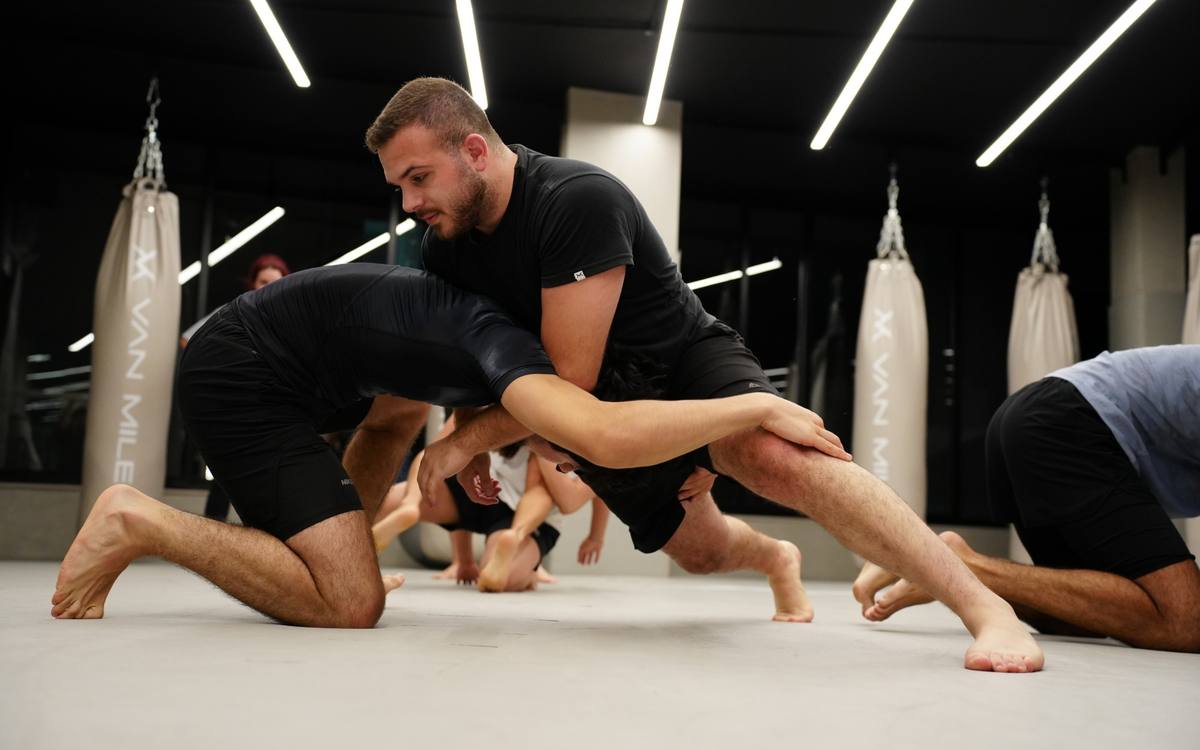 Takedown drill during a grappling class