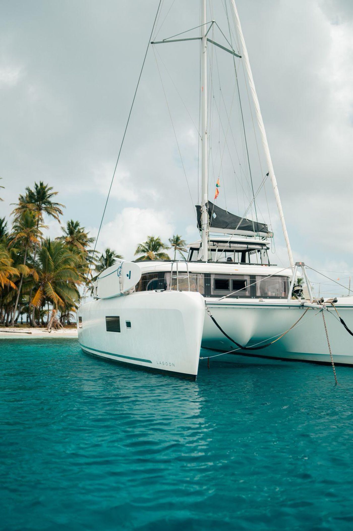 Private sailing catamaran among the islands of Guna Yala in Panama.