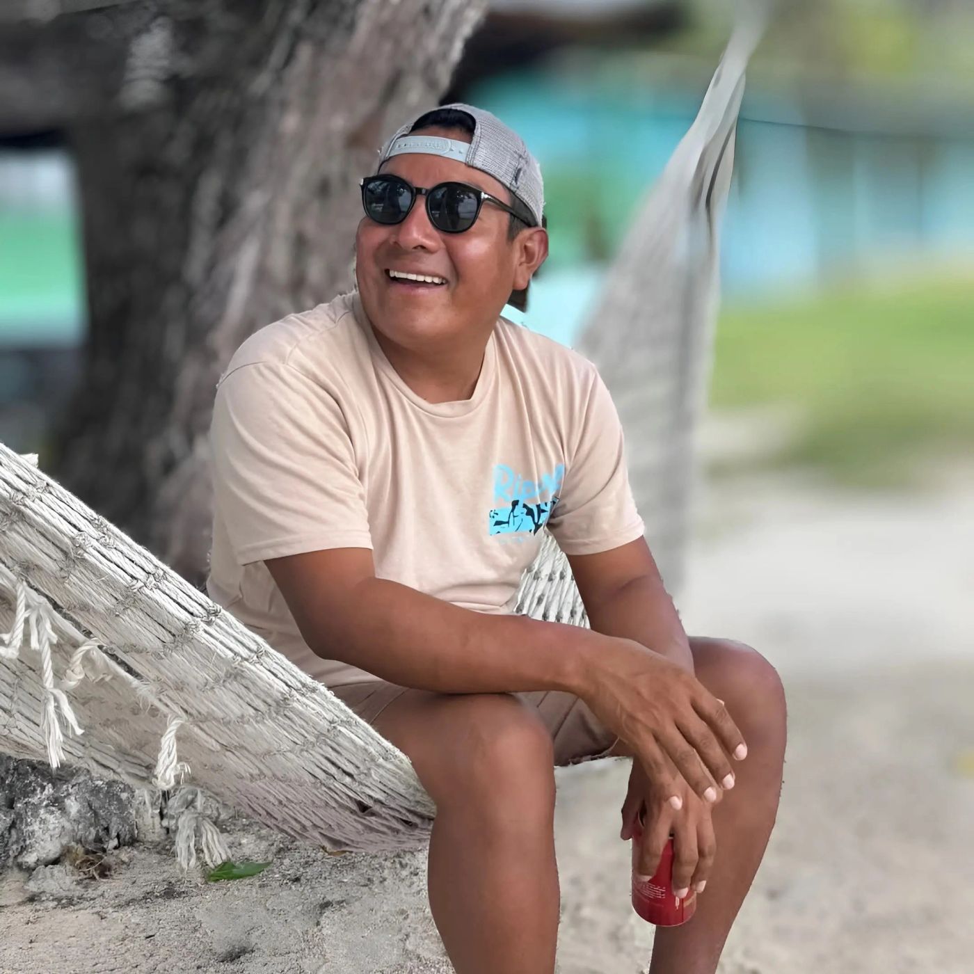 Victor Peretz relaxing in a hammock on a beach in Guna Yala