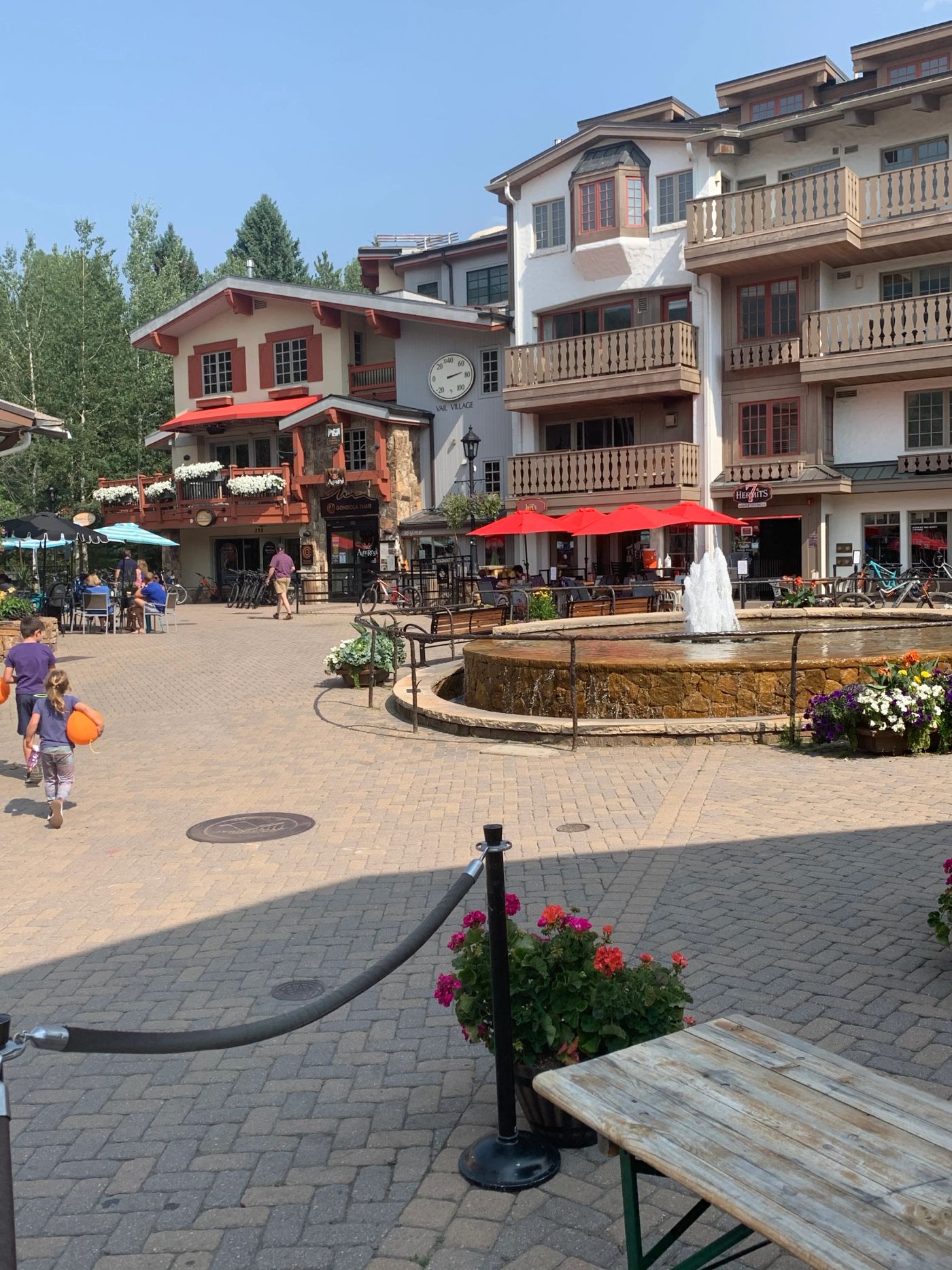 Fountain and alpine-style buildings in Vail Village, Colorado.