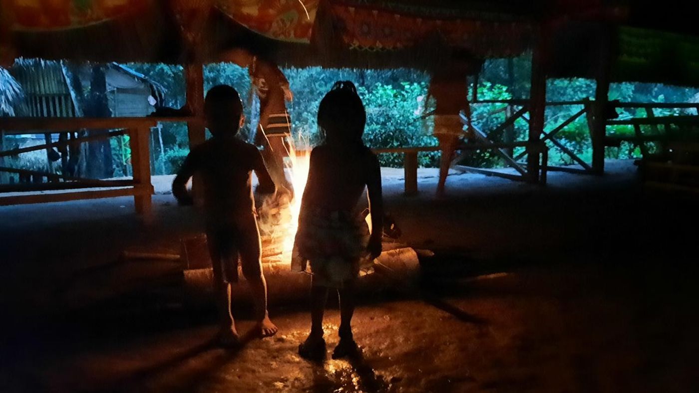 Family participating in a Emberá cultural experience during a private vacation in Panama.