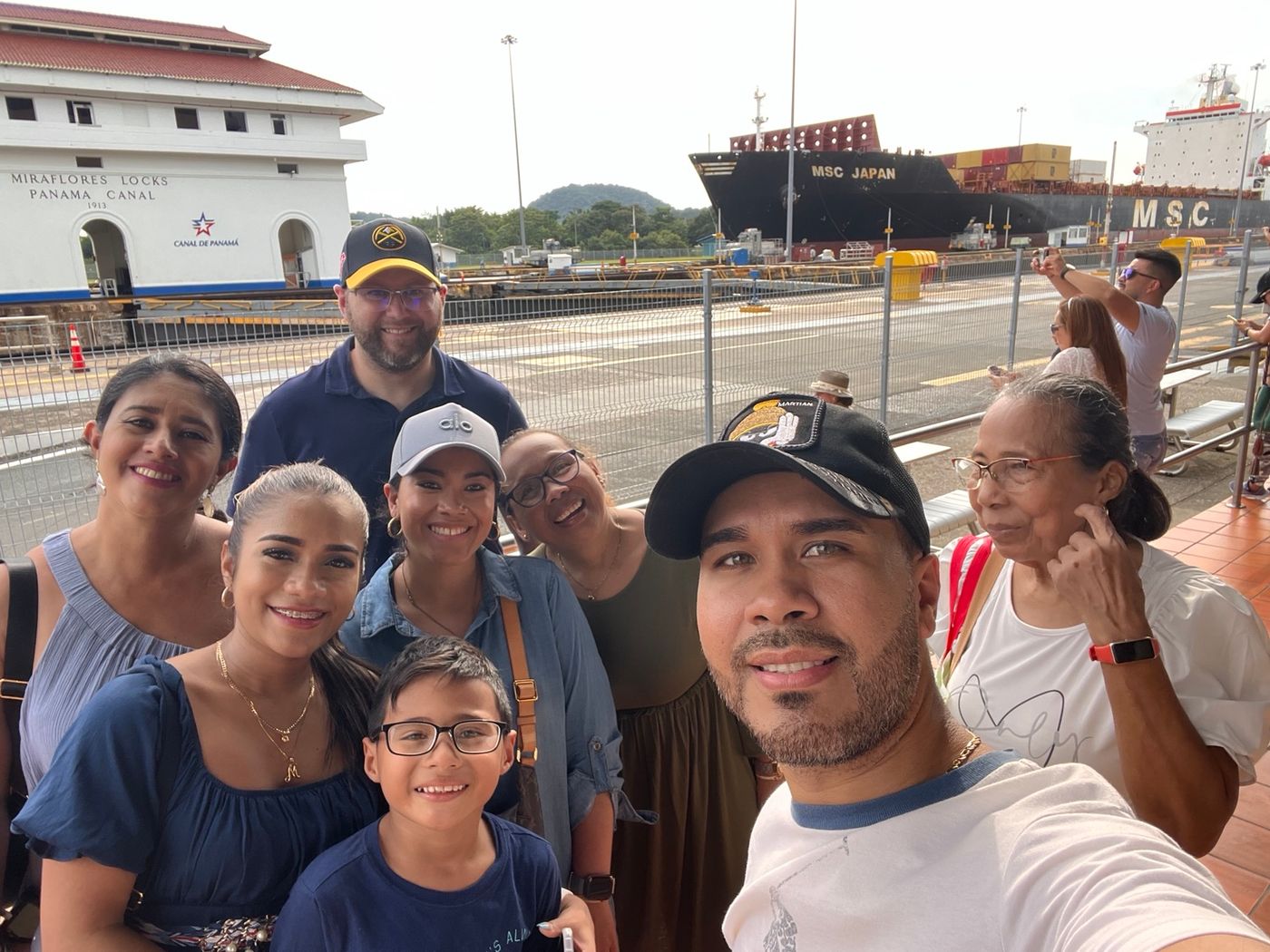 Family overlooking the Panama Canal locks during a visit in Panama.
