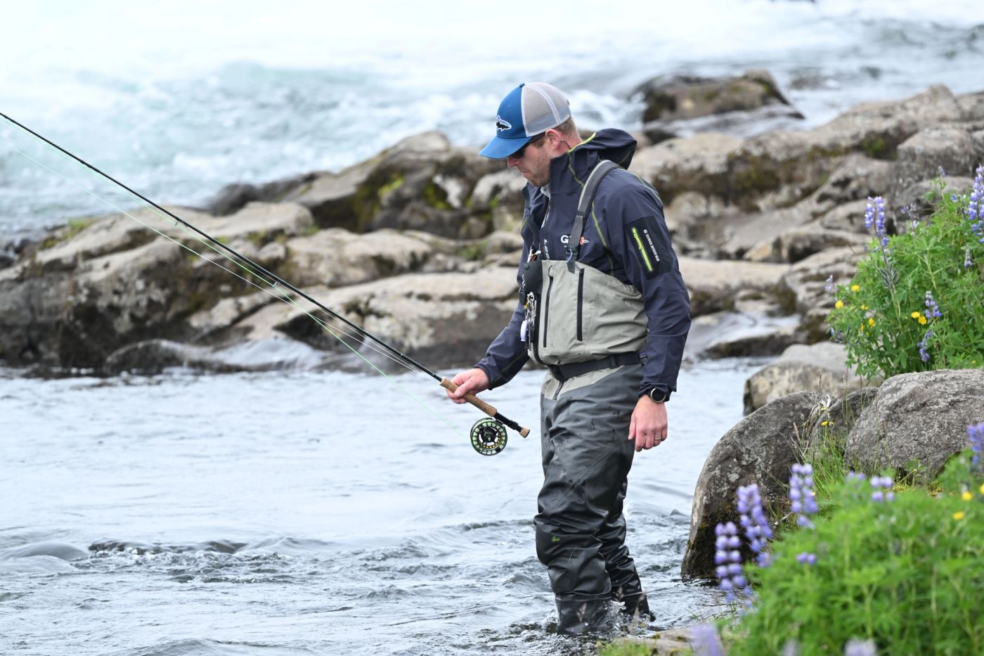 Fly fishing in a Colorado river during the summer.