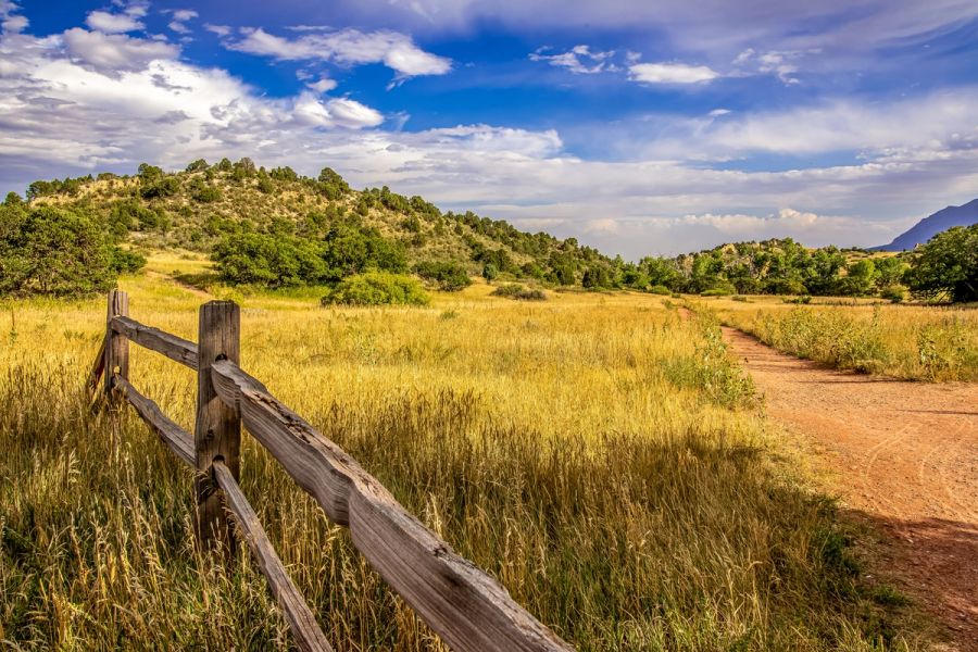Scenic Colorado dude ranch surrounded by mountain landscapes.