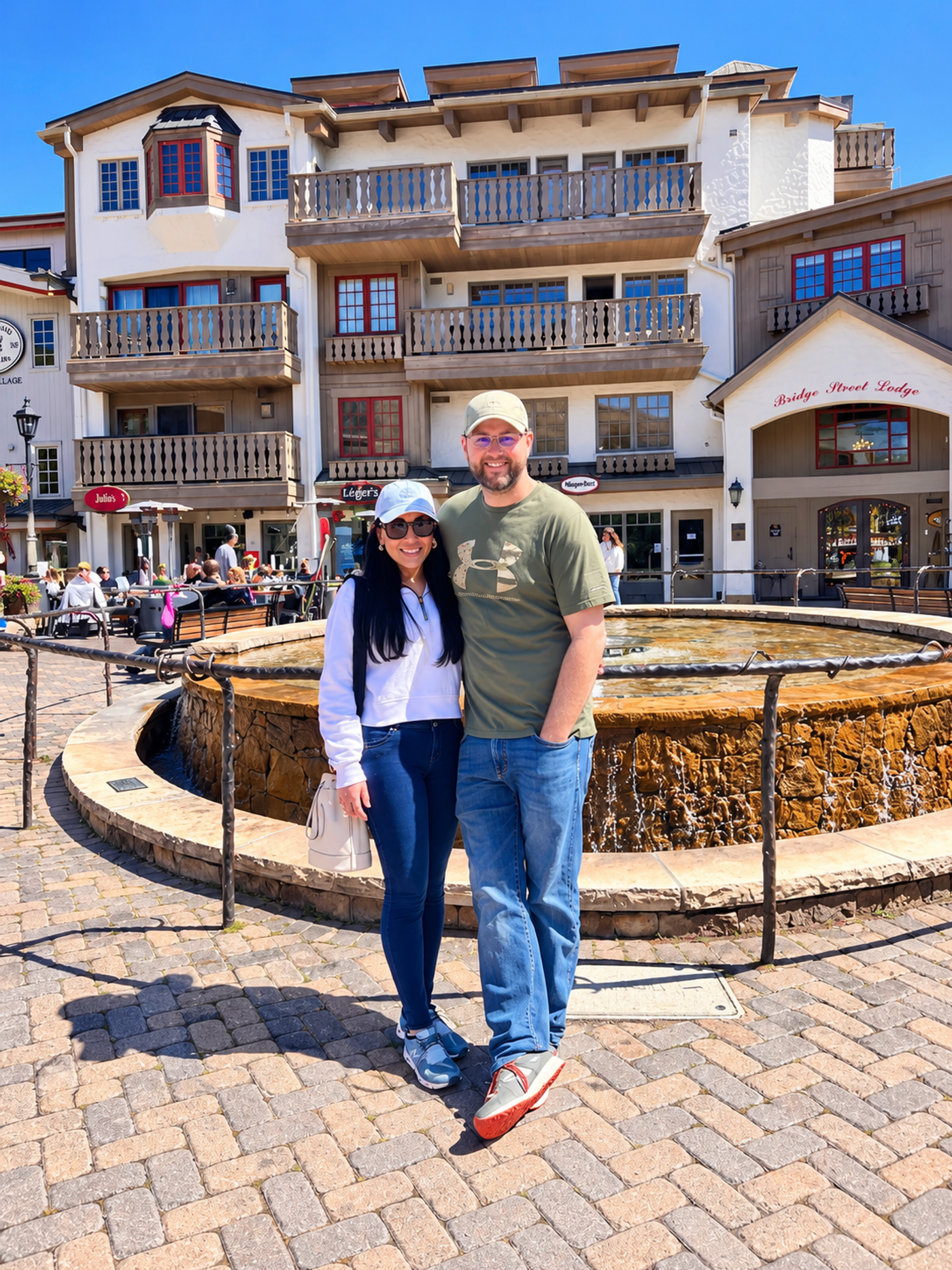 Jaury and Tyler by the fountain near Bridge Street Lodge in Vail Village