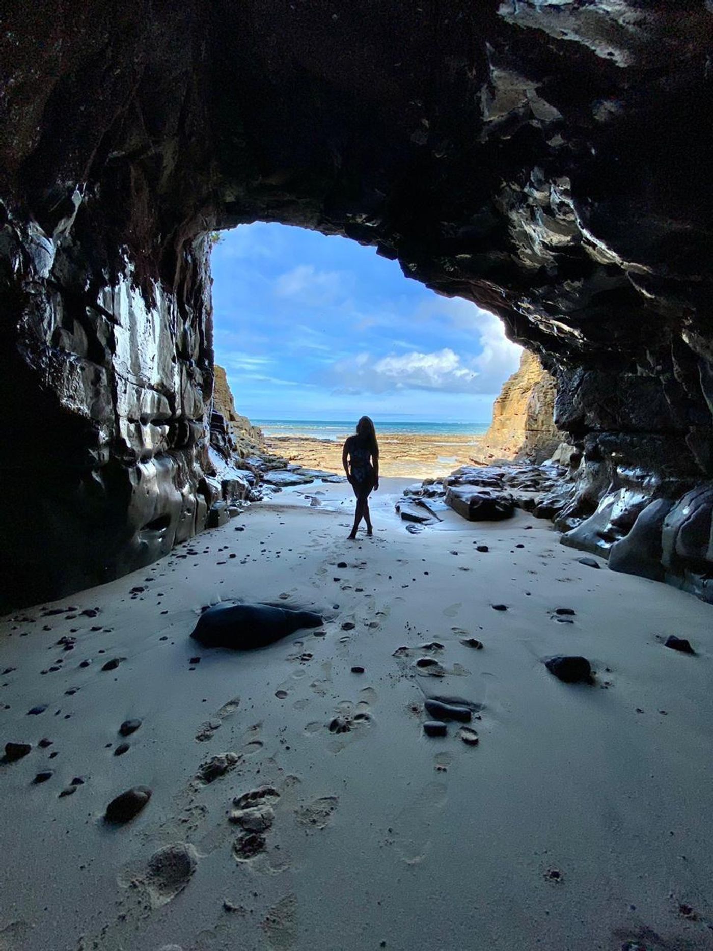 Travelers exploring a cave during an adventure experience in Panama.