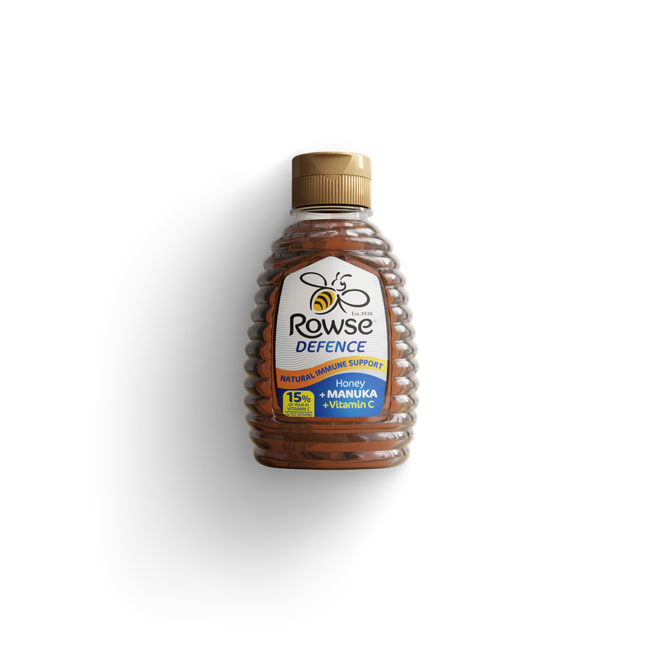 a bottle of rowse defence honey on a black background