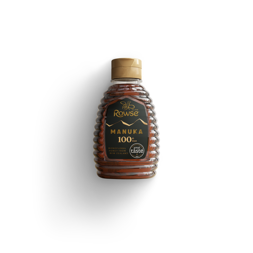 Rowse Manuka 100% pure honey in a beehive-shaped bottle with a gold cap.