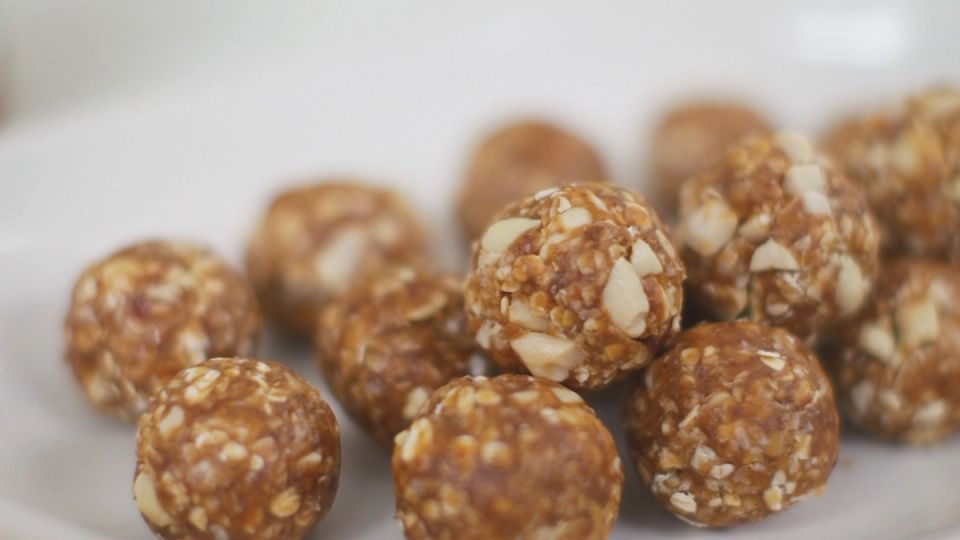 a close up of a plate of energy balls on a table .