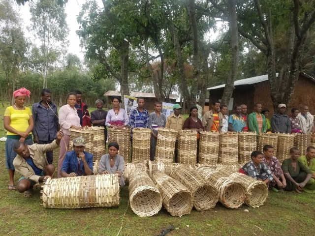 Beekeepers in Ethiopia making woven bee hives