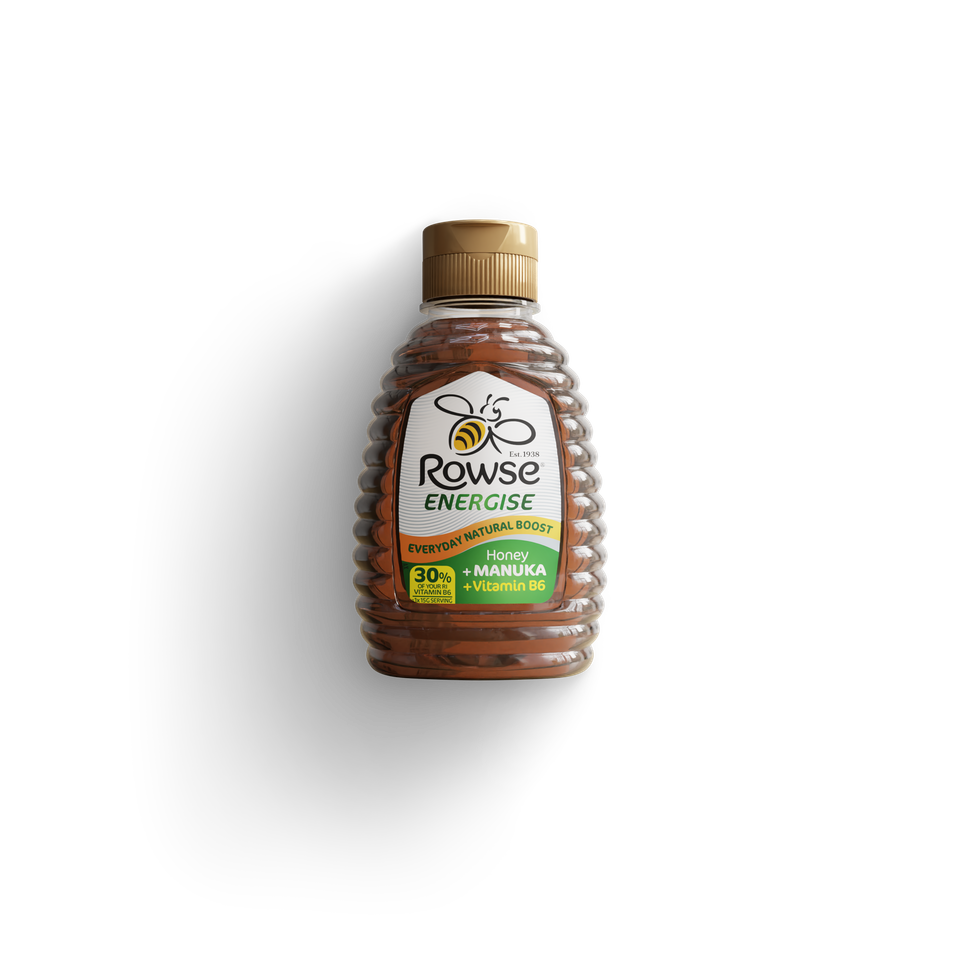 a bottle of rowse energise honey on a black background