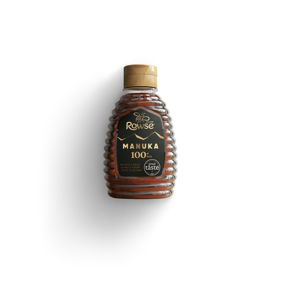 Rowse Manuka 100% pure honey in a beehive-shaped bottle with a gold cap.