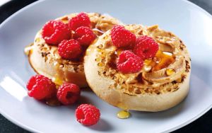 Crumpets with almond butter, raspberries and honey