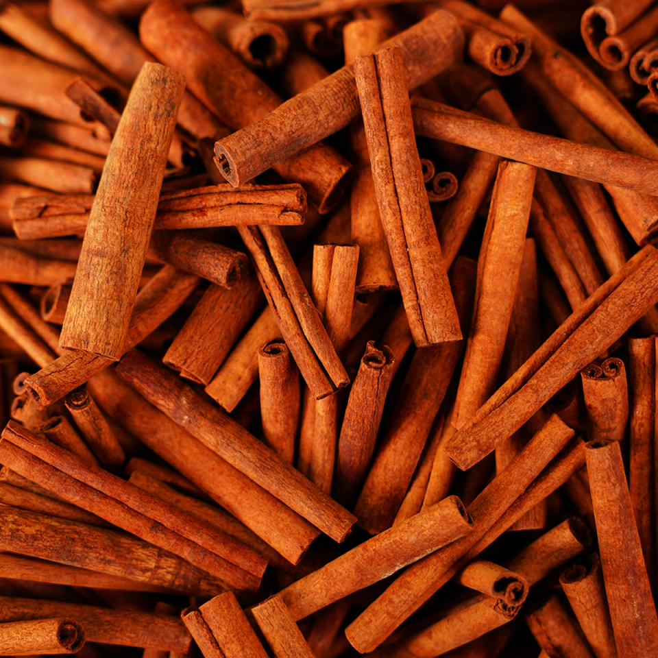 a pile of cinnamon sticks are stacked on top of each other