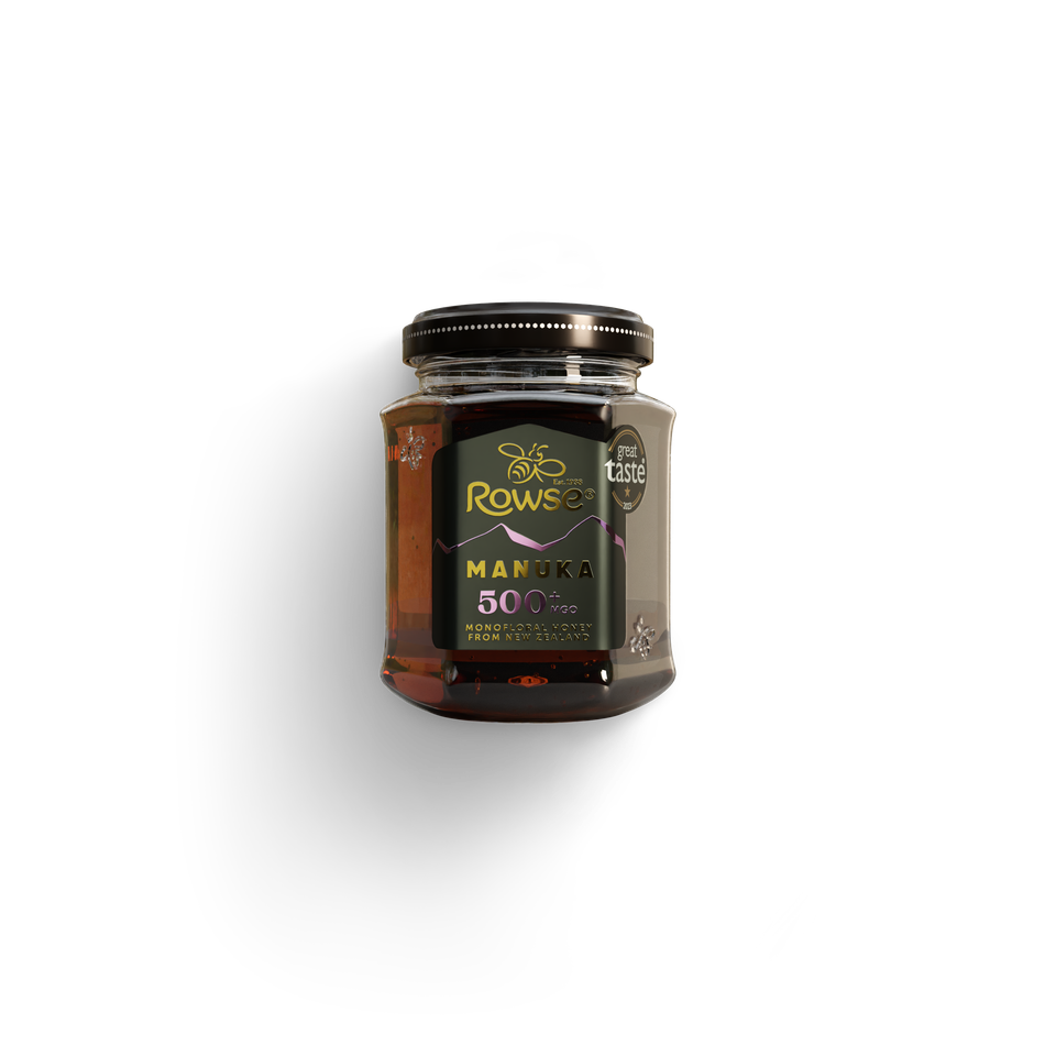 A jar of Rowse Manuka Honey 500 MGO on a white background.