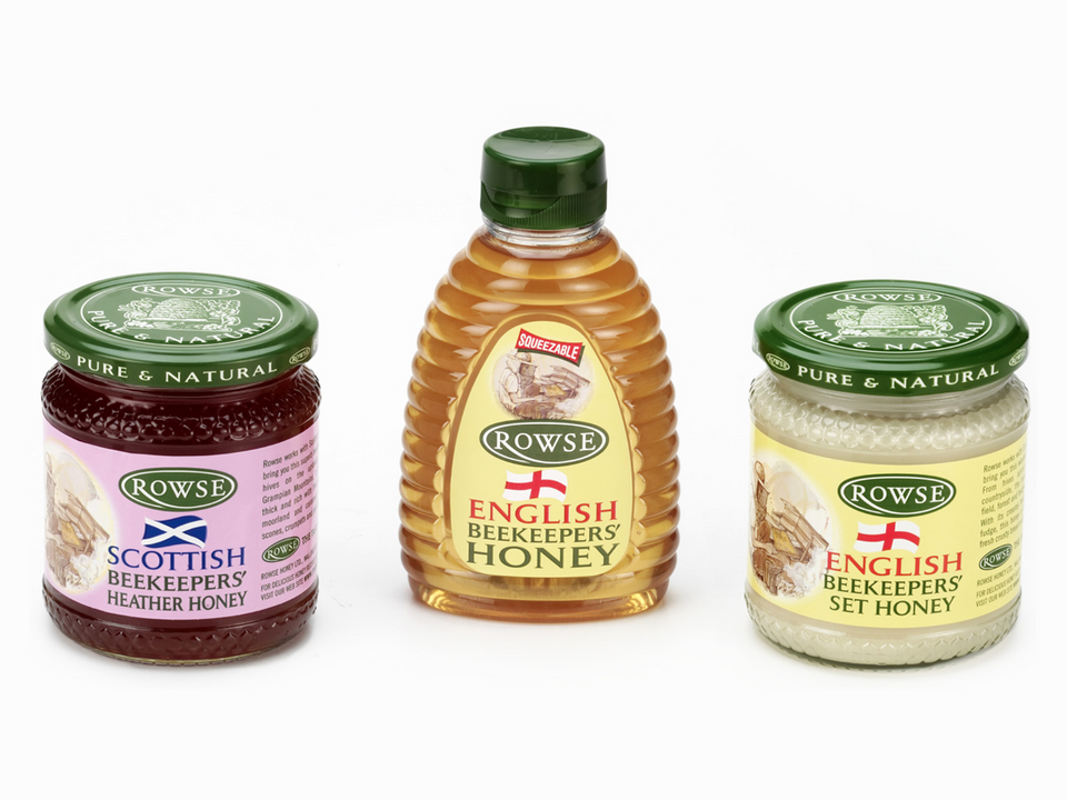 a jar of scottish beekeepers heather honey next to a bottle of english beekeepers honey