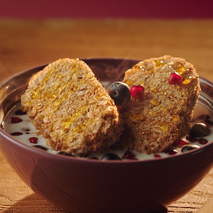 Warm milk, blueberries, pomegranate & Rowse honey Weetabix